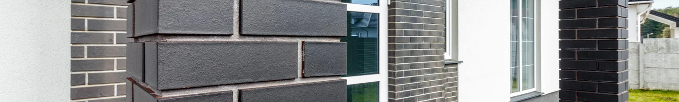 2f66585d-b2ae-40bd-bef2-f332c5e1de26-fragment-modern-building-lined-with-decorative-bricks-old-style.jpg